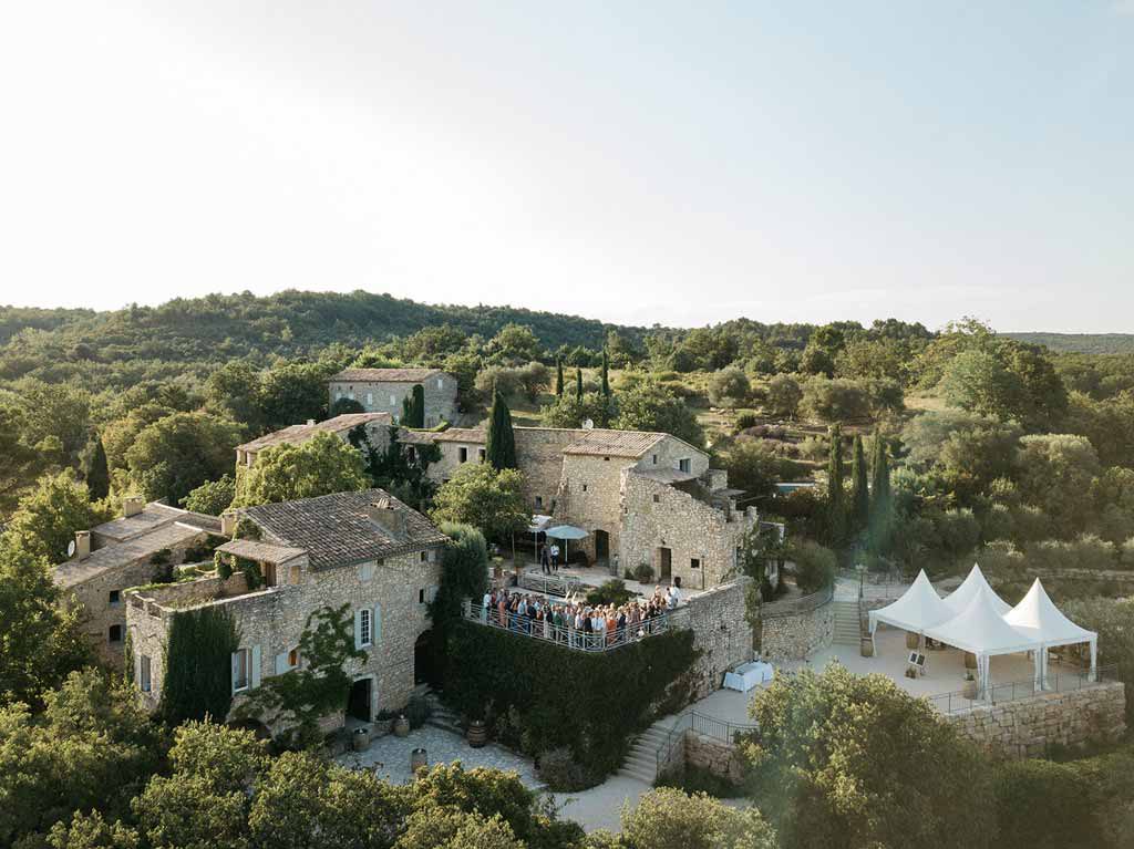 The Domaine's stone buildings set among wooded hills
