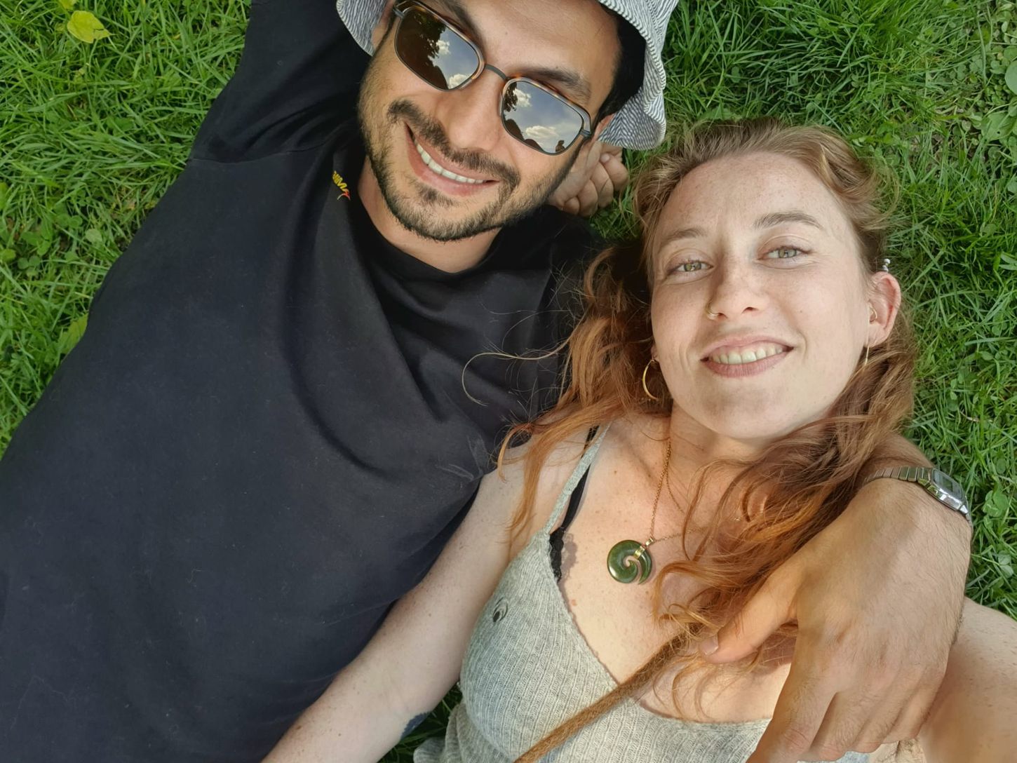 The two of us lying in the grass on a summer day